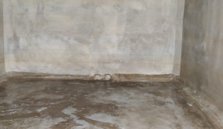 India Tank Cleaners cleaning underground sump in Chennai using vacuum suction and safety gear."