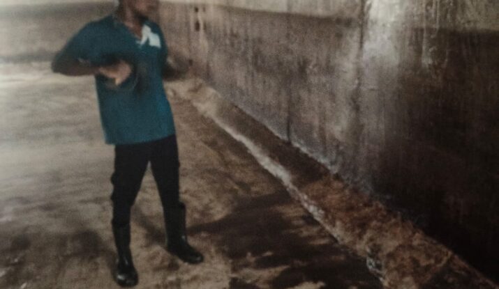 Professional Water tank cleaning service Adyar technician wearing PPE gear including gloves, boots, mask, and protective sui